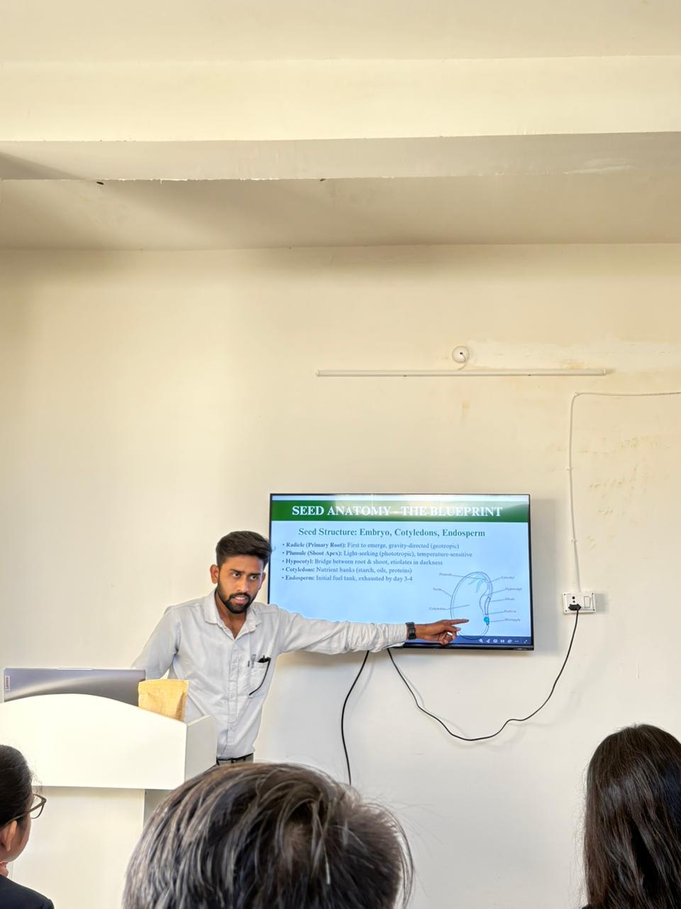 Students practicing seed tray preparation in workshop session